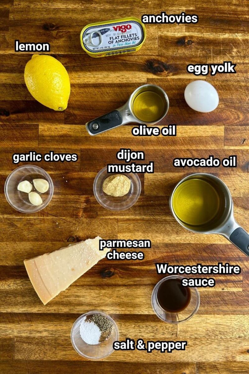 ingredients for traditional Caesar dressing with anchovies and egg