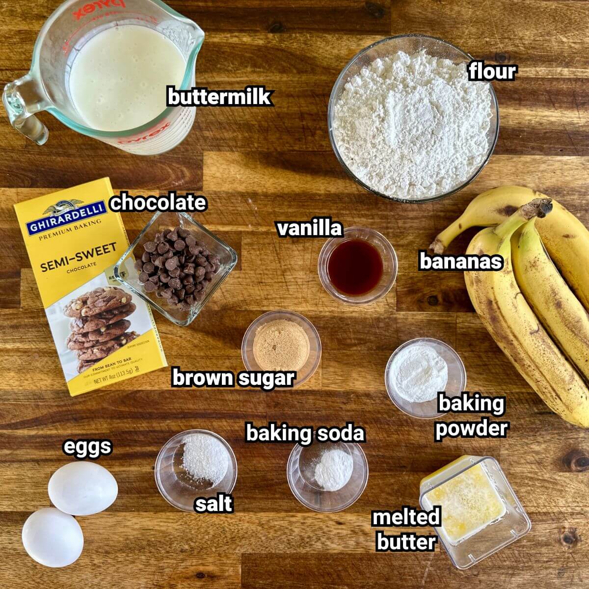 ingredients for banana chocolate chip pancakes measured out in bowls