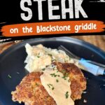 country fried steak with gravy and mashed potatoes on a plate