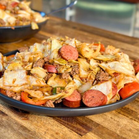 dirty cabbage with smoked sausage, ground beef, and bell peppers