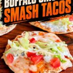 Finished Buffalo chicken smash taco topped with melted cheese, lettuce, tomato, blue cheese, and ranch, with text reading “Buffalo Chicken Smash Tacos.”