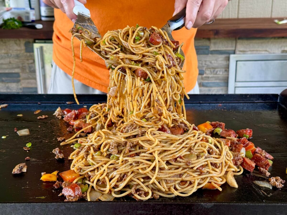 dirty spaghetti with ground beef, andouille sausage, and vegetables