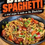 Bowl of Dirty Spaghetti with smoked sausage, ground beef, mushrooms, peppers, celery, and onions, with text reading “Dirty Spaghetti—a viral recipe to make on the Blackstone.”
