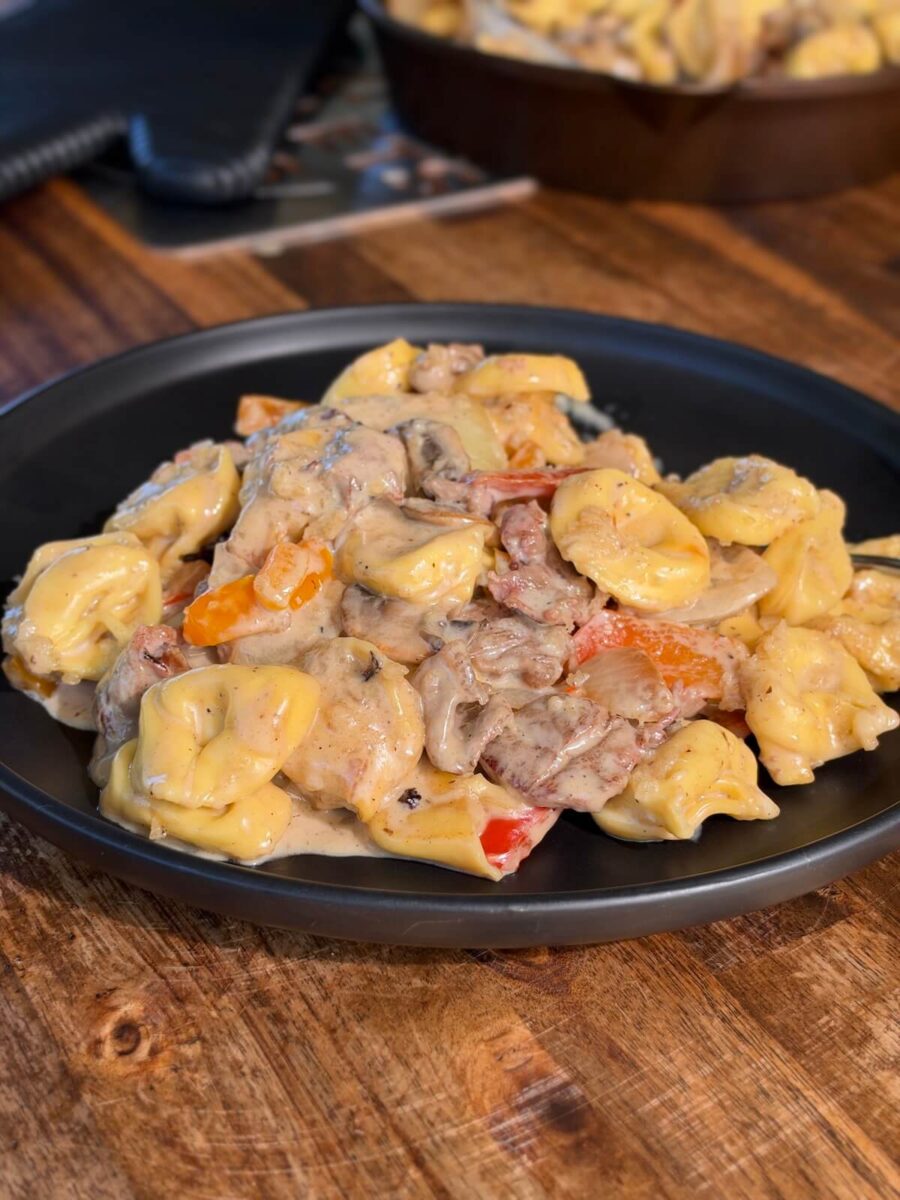 Philly cheesesteak tortellini pasta on a plate