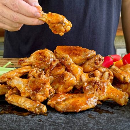 crispy chicken wings covered in buffalo sauce and served with celery sticks