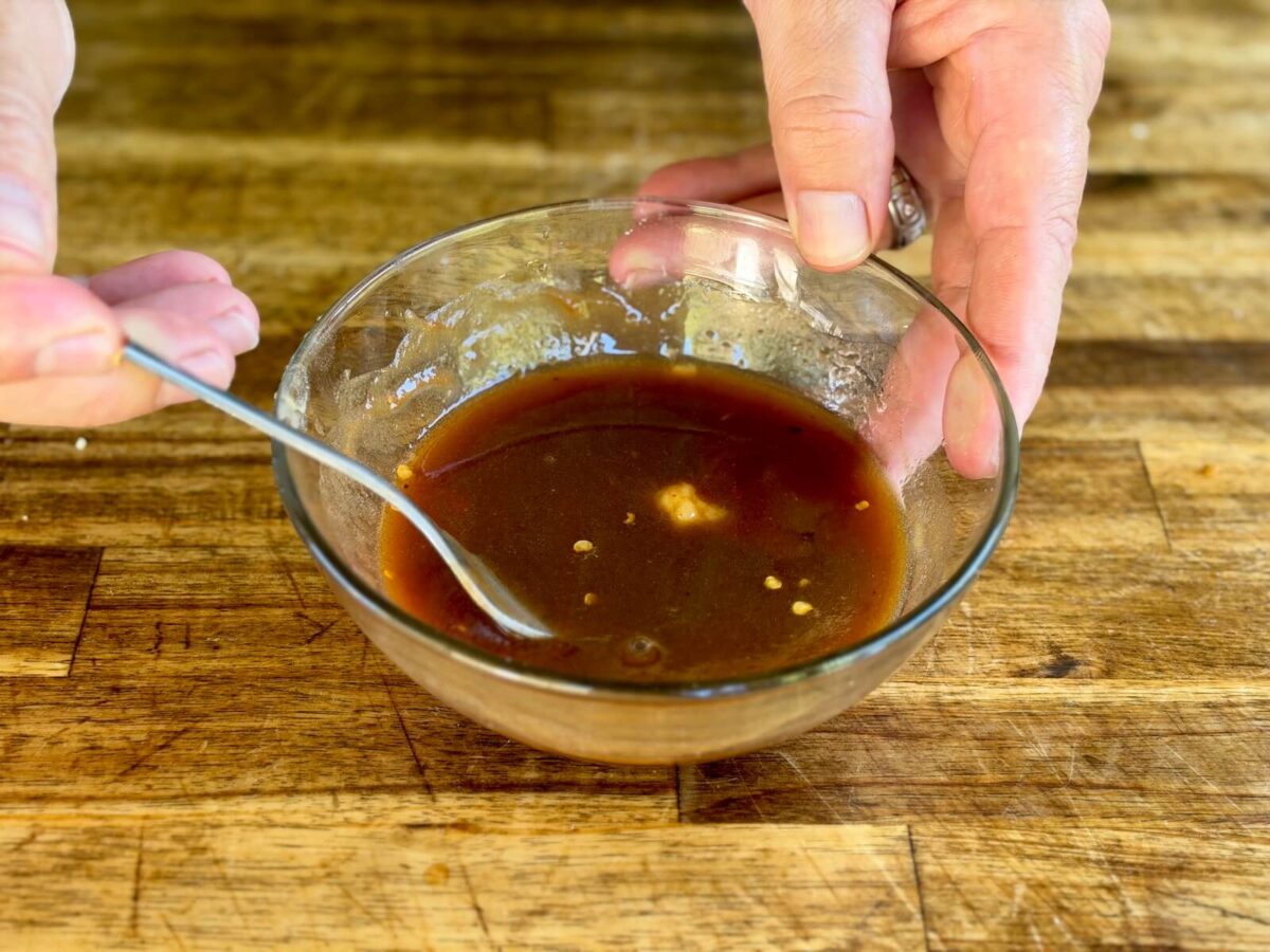 mixing a pad thai sauce in a bowl